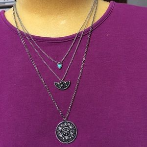 Three tier necklace with a small blue heart